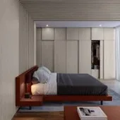 Dormitorio minimalista con cama empotrada en un módulo de madera